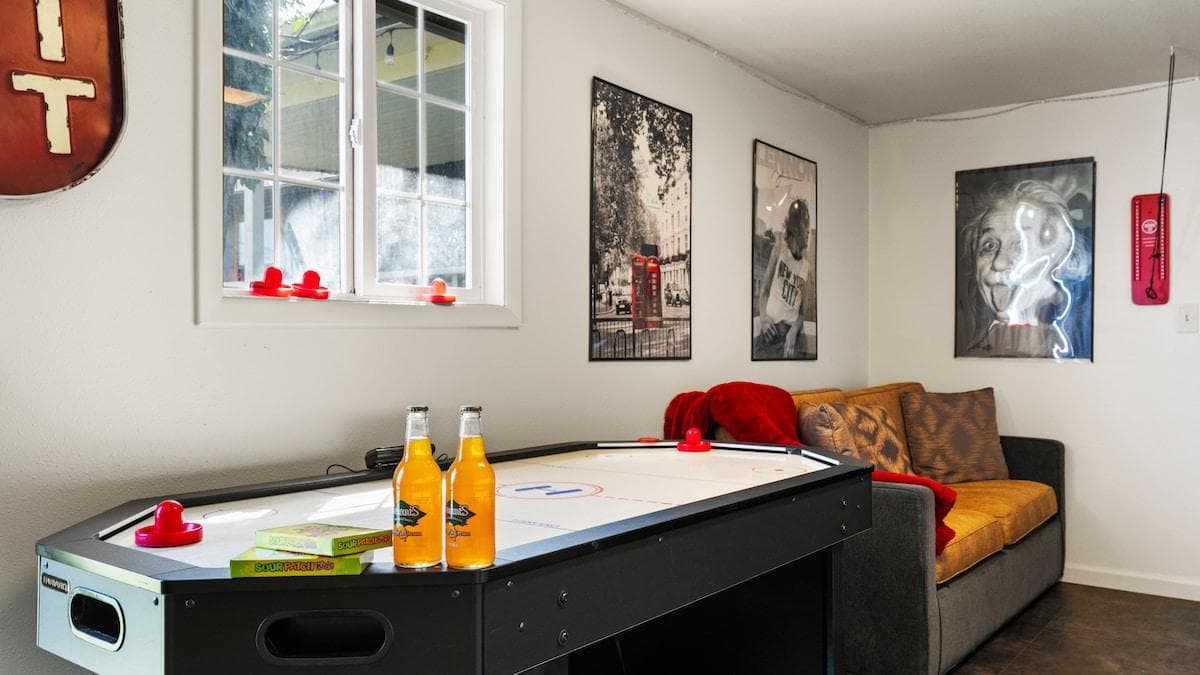 Game Time in the Bonus Room 
Bring on the fun with air hockey, cozy seating, and nostalgic wall art—your perfect hangout zone for all ages.
