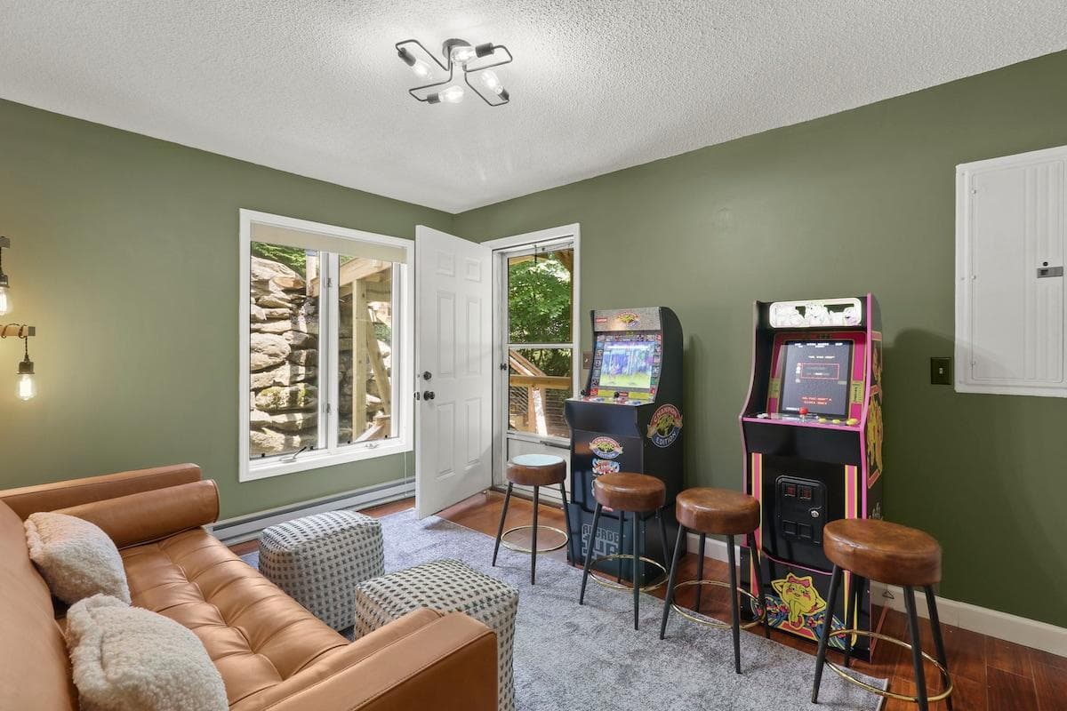 Pac-Man and Golden Tee in a cozy lounge? Game night just leveled up. Vrbo: Game room with arcade classics and retro vibes.