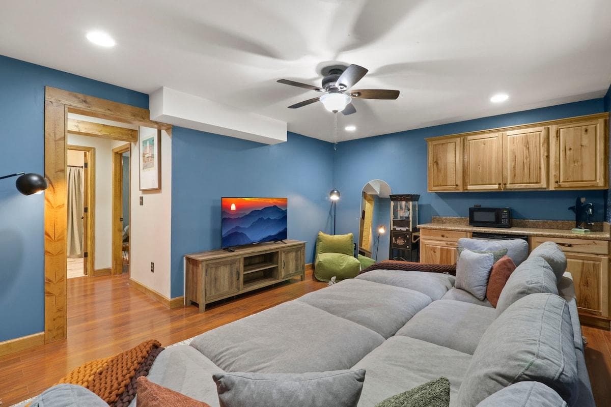  Oversized sofa and Smart TV create the perfect home theater lounge. 